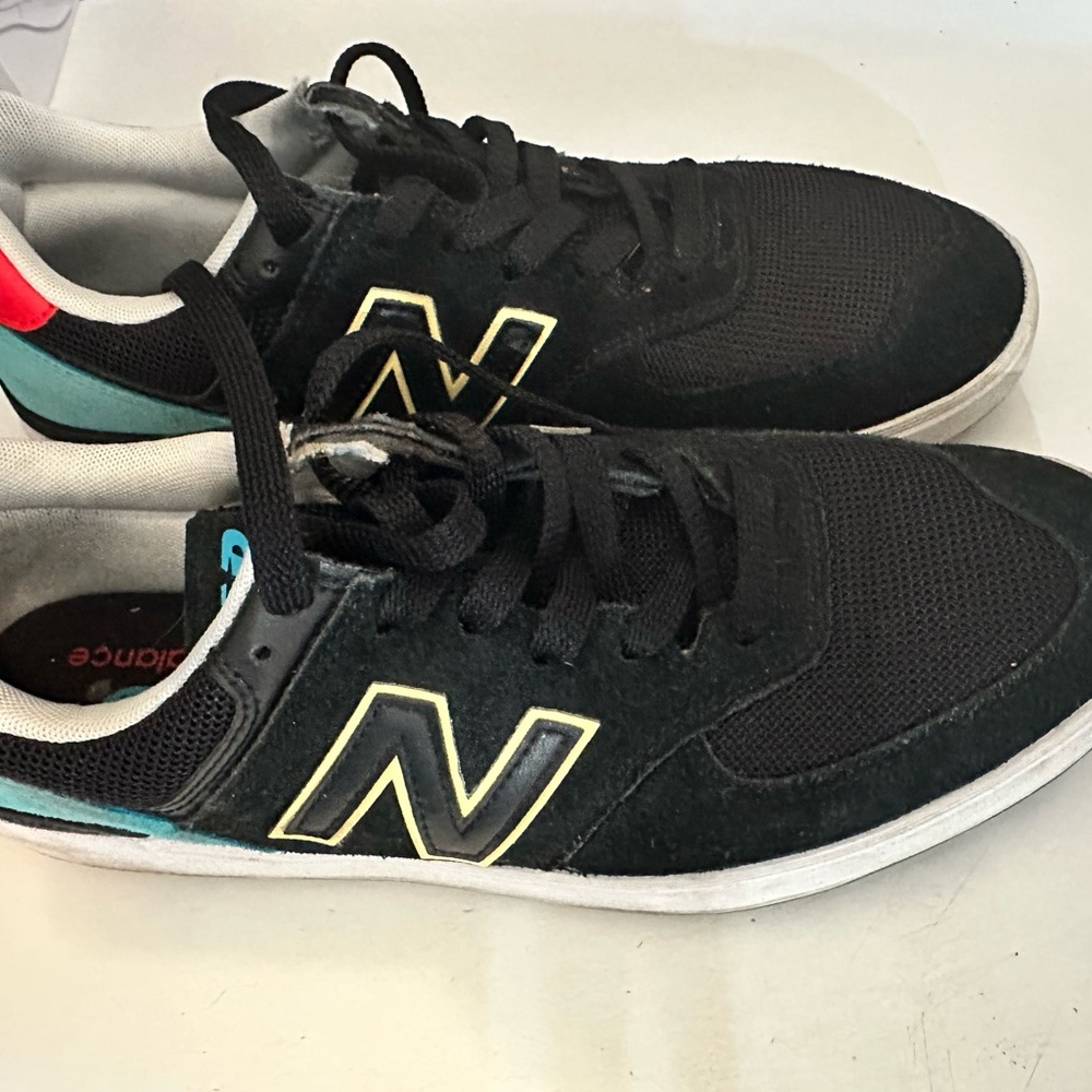 New Balance Black and Teal Sneakers with White Details court line